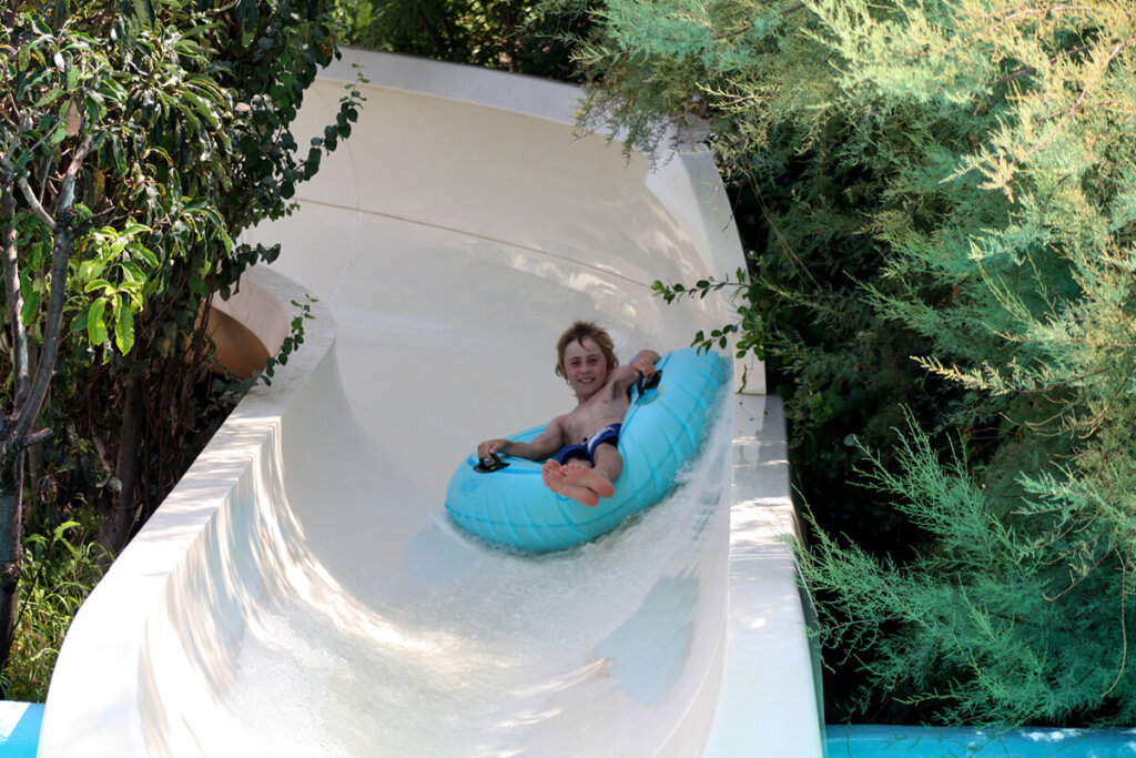 Child on a tube on the 100 metre Giant slide